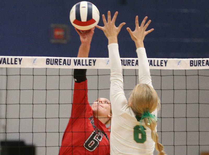 Erie-Prophetstown's Jamie Neumiller sends a spike past Seneca's Graysen Provance in the Class 2A Sectional semifinal game on Tuesday, Nov. 5, 2024 at Bureau Valley High School.