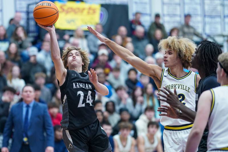 Kaneland’s Luke Reinert (24) shoots the ball against Yorkville Christian's Noah Aguado (22) during a championship final basketball game in the 61st annual Plano Christmas Classic at Plano High School on Saturday, January 1, 2017.