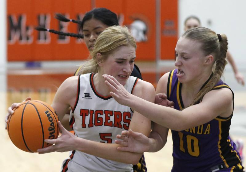 Crystal Lake Central's Ruby Macke tries to drive to the basket against Wauconda's Emma Wisniewski during the Northern Illinois Holiday Classic Championship girls basketball game on Thursday, Dec. 19, 2024, at McHenry High School.