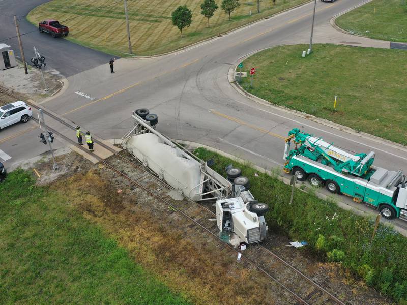 Photos: Sand hauler semi truck overturns on Ottawa's west side