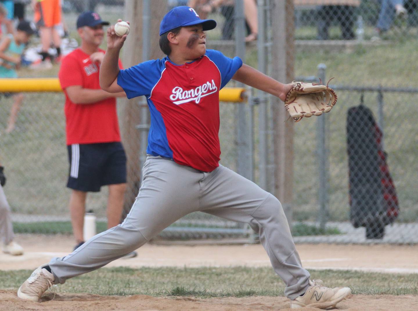 Frostbyte MSP Rangers closer Bryce Ceja delivers a pitch to Thrush Sanitation Red Sox during the Ottawa Little League baseball (12U) City Championship on Friday, June 23, 2023 at Varland Park in Ottawa.
