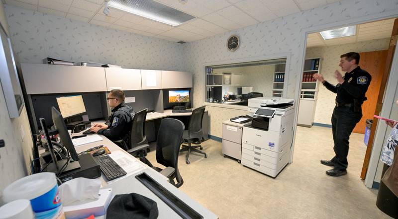 Deputy Police Chief Matt Dean shows the current report writing area officers to use, during tour of the current Geneva Police Department. A $59.4 million public safety referendum will be on the March 17, 2026 primary ballot.