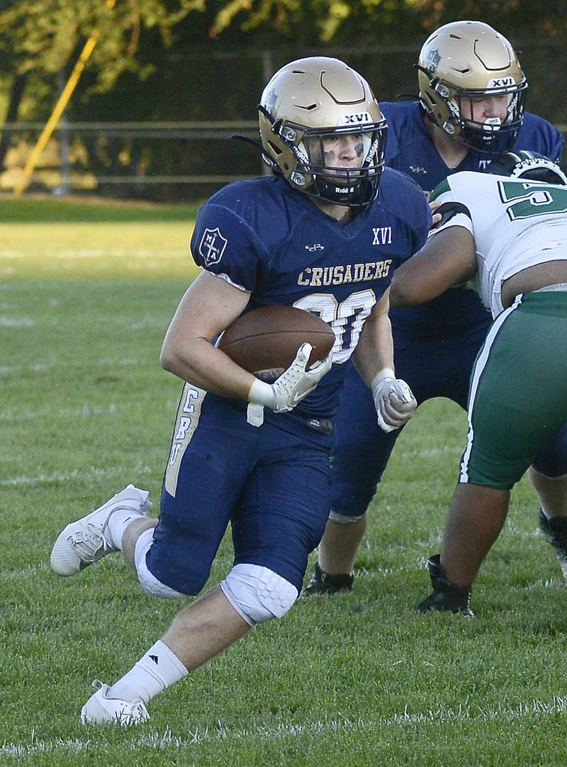 Marquette’s Jacob Smith looks for an opening in the Madison line on a run Friday in the 1st quarter at Marquette.