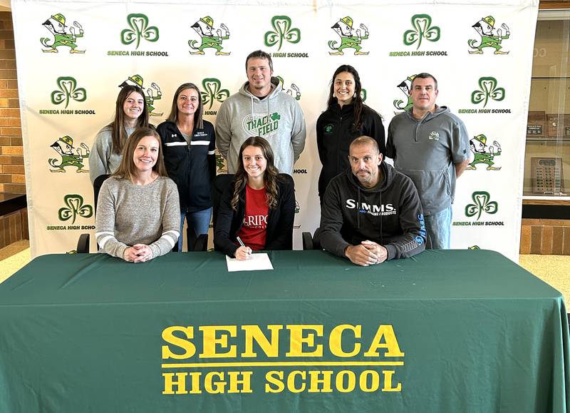Seneca’s Gracie Steffes has signed on to continue her education at Ripon College in Ripon, Wisc., and her running career at the NCAA Division 3 level with the Red Hawks. Steffes, a cross country and track competitor for the Fighting Irish, was a member of the 2024 Times Girls Track and Field All-Area Honor Roll. Pictured at her signing ceremony were, from the left: in front – Emiley Steffes, Gracie Steffes and Jason Steffes; and in back – Ruthie Steffes and Seneca athletic staff Kim Foster, Terry Maxwell, Eva Bruno and Ted O’Boyle.