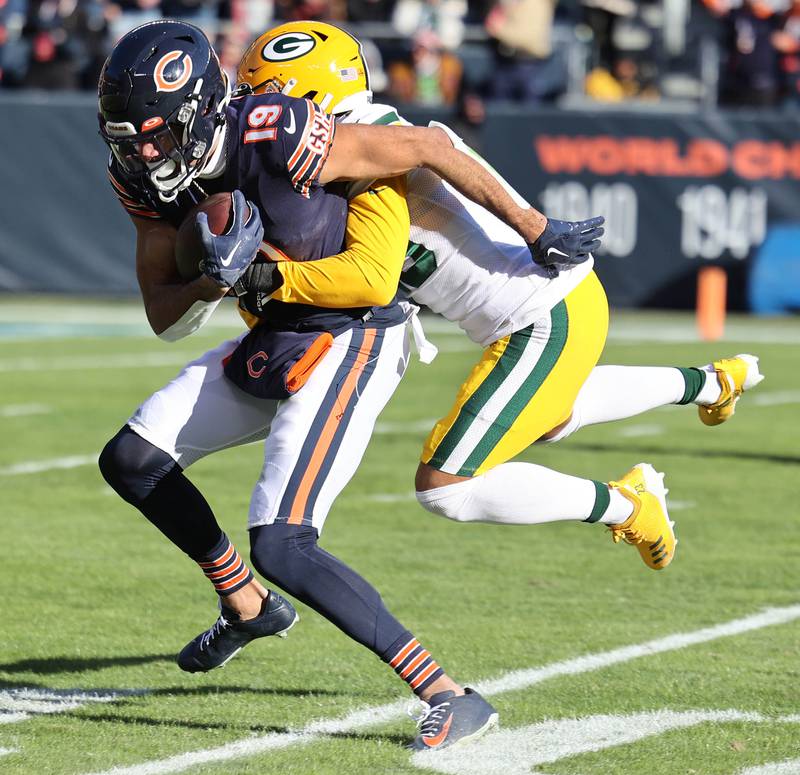 Chicago Bears Equanimeous St. Brown hauls in a long pass and carries Green Bay Packers Jaire Alexander for a few extra yards during their game Sunday, Dec. 4, 2022, at Soldier Field in Chicago.