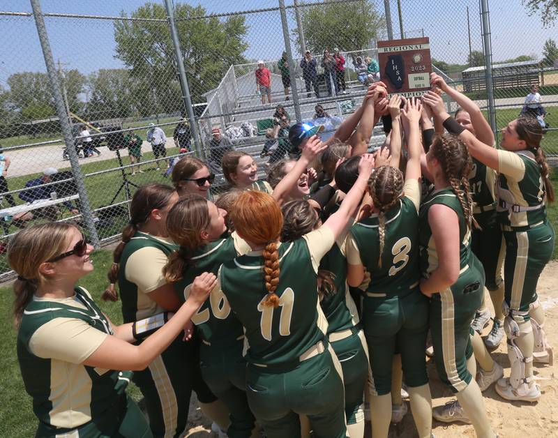 Members of the St. Bede softball team hoist the Class 1A Regional plaque after defeating Annawan/Wethersfield 12-0 in the Class 1A Regional final game on Saturday, May 20, 2023 in Annawan.
