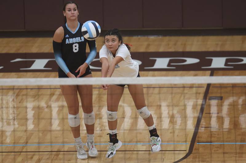 Joliet Catholic’s Carmella Cook receives the serve against Providence on Thursday, Sept. 14, in Joliet.