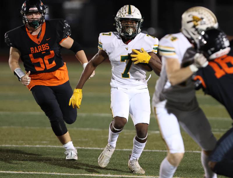 Waubonsie Valley's Tyler Threat gets by DeKalb’s Owen Sisson during their game Friday, Sept. 29, 2023, at DeKalb High School.