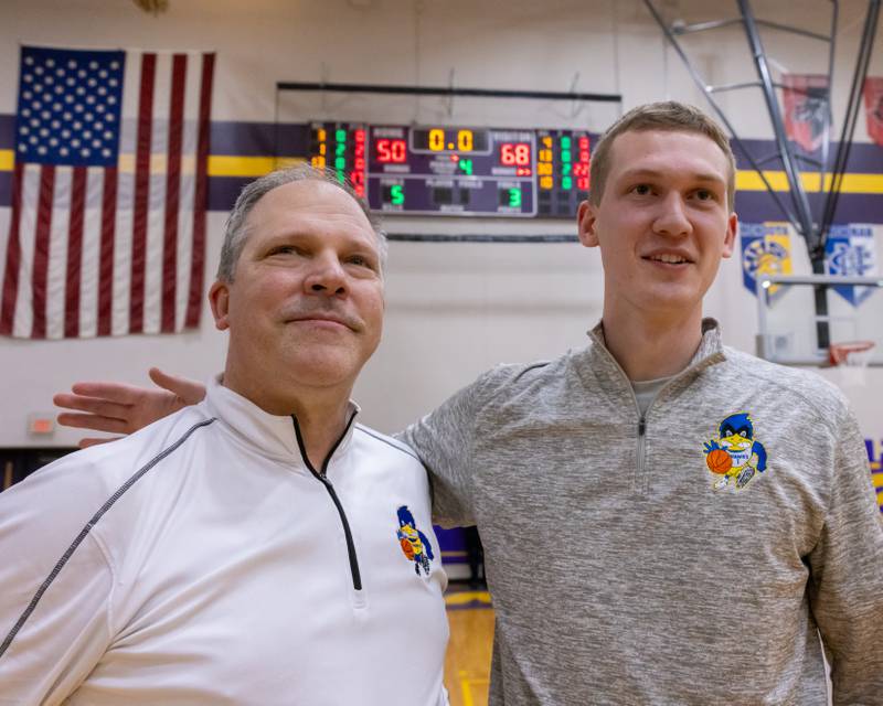 Head Coach Mike Toussaint and Assistant Coach Kyle Muehlfelder take a moment to look on as their players celebrate winning the IHSA 2A Sectional Championship game on March 6, 2026 at Mendota High School.