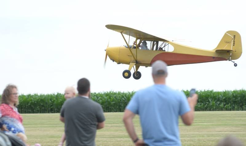 Visitors to the Ogle County Airport Fly In/Drive In Breakfast on Friday, July 4, 2025, watch a plane take off from the airport, at 3019 IL-64, just east of Mt Morris.