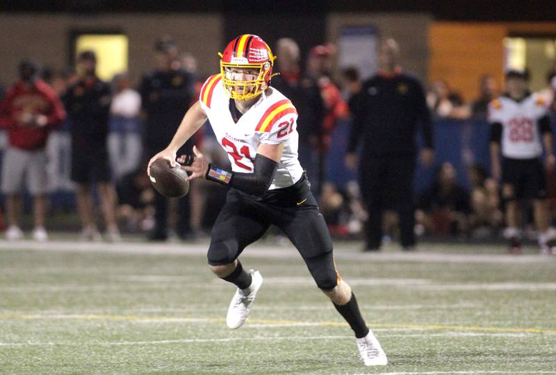 Batavia quarterback Ryan Boe looks to pass the ball during a game at Geneva on Friday, Sept. 29, 2023.