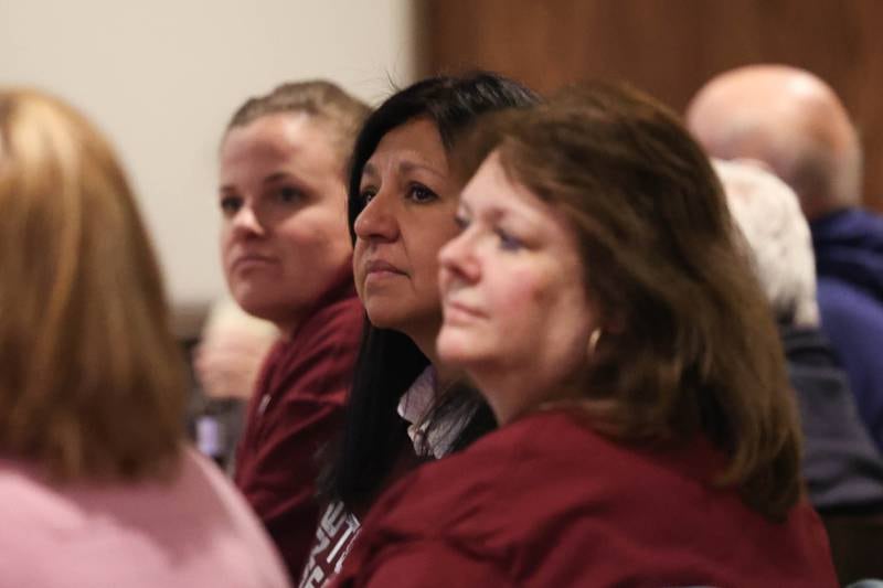 Lockport Township High School District 205 President Ann Lopez, center, looks at the early vote results for the Central Campus referendum at the watch party at Coom’s Corner on Tuesday, March 19 in Lockport.