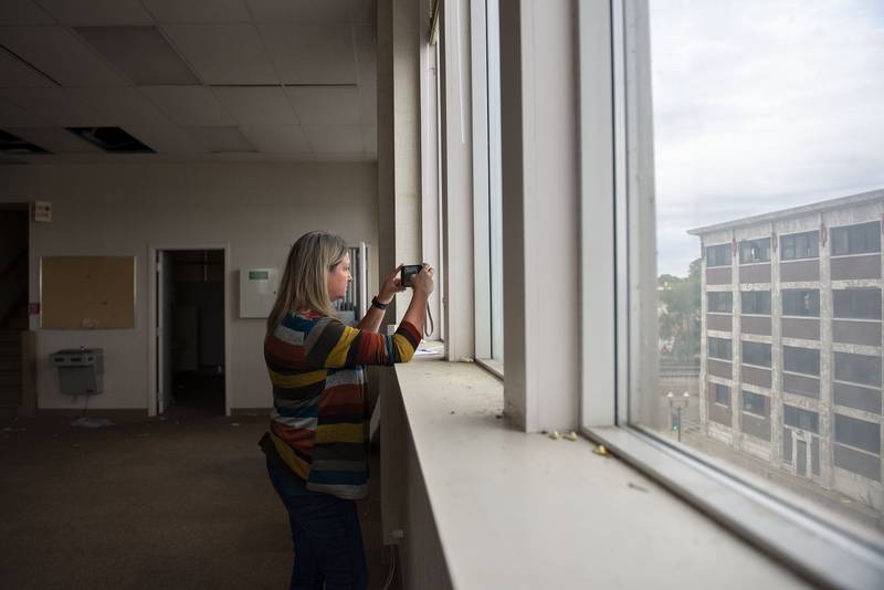 Lori VanOosten snaps a picture while taking a public tour of the National building on Oct. 5, 2022. The Sterling Riverfront Commission provided several such tours last year. The master plan for the Lawrence Bros. and National sites, part of the $300-million-plus Riverfront Reimagined Project, is in the hands of the Sterling City Council and available for residents to peruse.