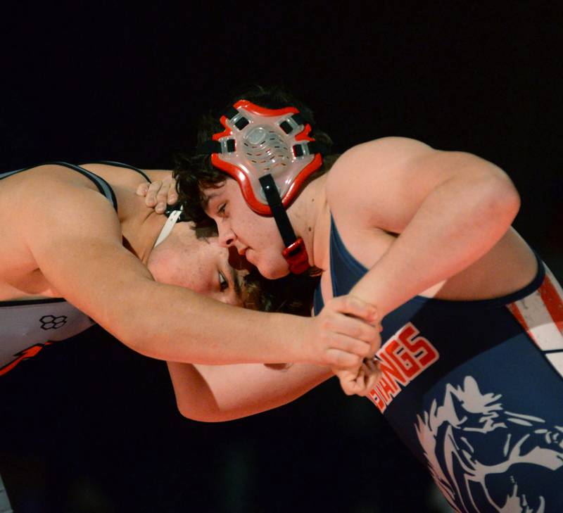 Morrison's Corbin Allen (right) locks hands with his Sandwich opponent in a 215-pound match at a triangular meet with Oregon on Friday, Jan. 31, 2025 in the Blackhawk Center at Oregon High School.