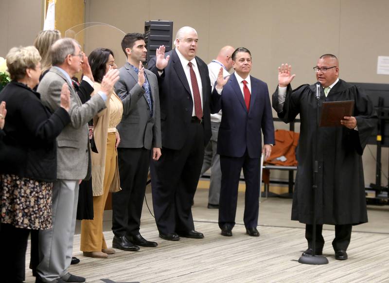 Kane County Circuit Judge Julio Cesar Valdez presides over the swearing in ceremony for newly and re-elected board members at the Kane County Circuit Court in St. Charles on Monday, Dec. 5, 2022.