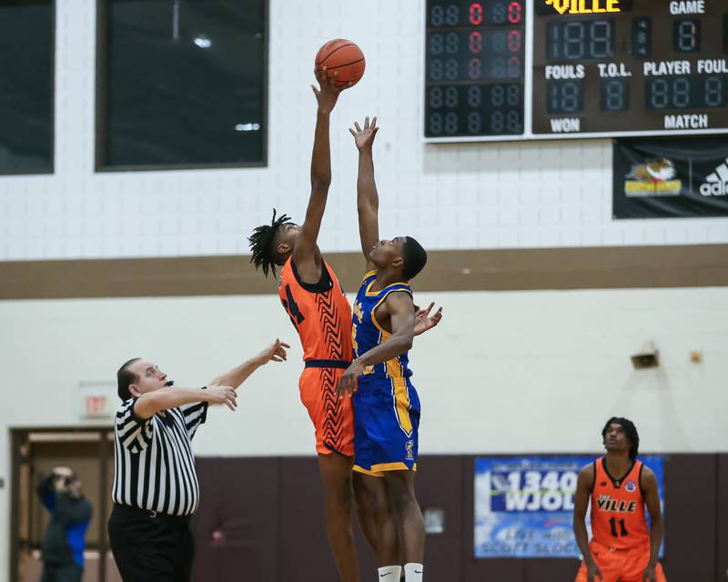 Romeoville's Adam Walker (34) wins the tiipoff vs Joliet Central's Isaiah Mollete (4) in the WJOL Tournament Championship game. Nov 25, 2023.
