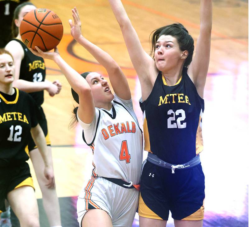 DeKalb's Ella Medina gets up a shot over Metea Valley’s Jamie Nosek during their game Thursday, Jan. 19, 2023, at DeKalb High School.
