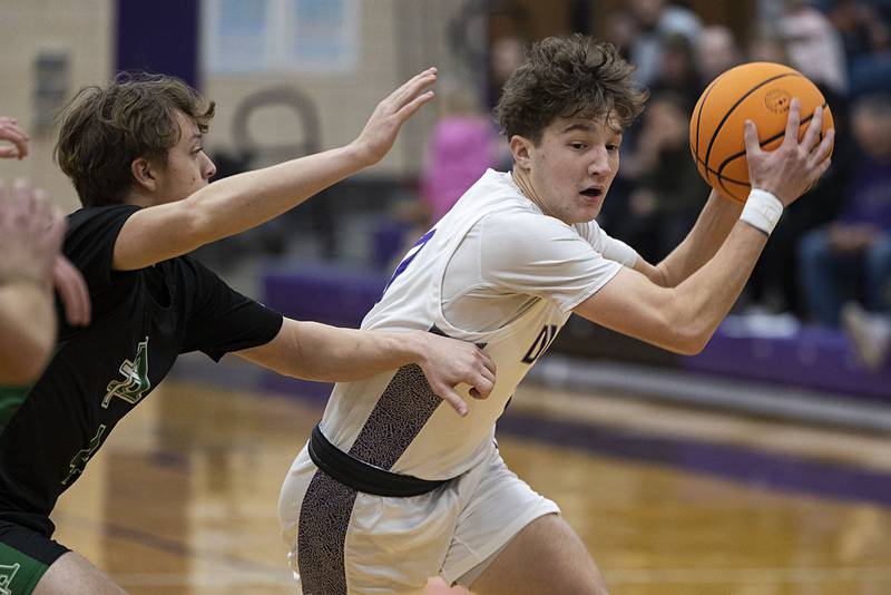 Dixon’s Brody Nicklaus handles the ball against Alleman Wednesday, Jan. 28, 2026.
