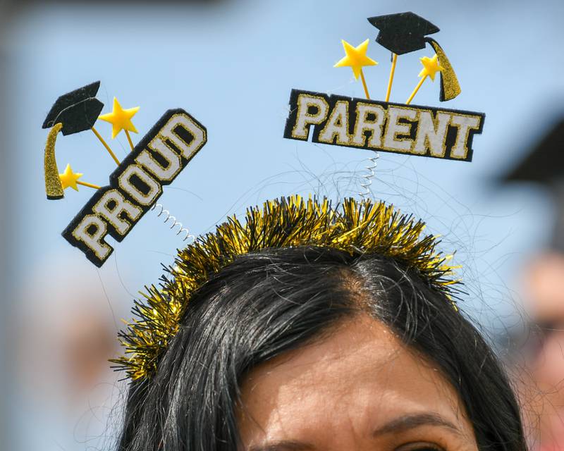 A proud parent of a Northern Illinois University graduate shows her pride while waiting to reunite with her graduate after the graduation ceremony on Saturday May 9, 2026, held at the Convocation Center in DeKalb.