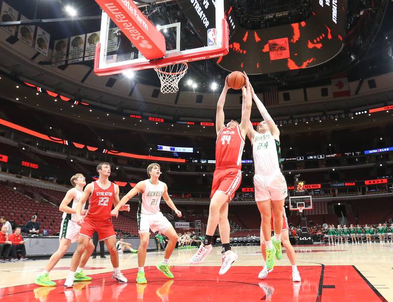 Streator's Nolan Lukach grabs a rebound over Seneca's Grant Siegel during a game on Tuesday, Dec. 21, 2023 at the United Center in Chicago.