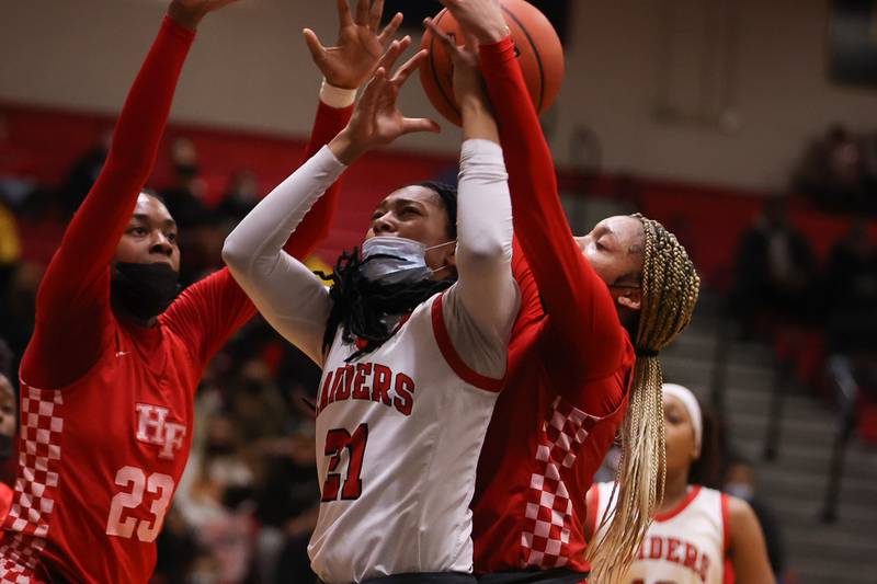 Bolingbrook’s Persais Williams draws the foul taking a shot against Homewood-Flossmoor in the Class 4A Bolingbrook Sectional championship. Thursday, Feb. 24, 2022, in Bolingbrook.