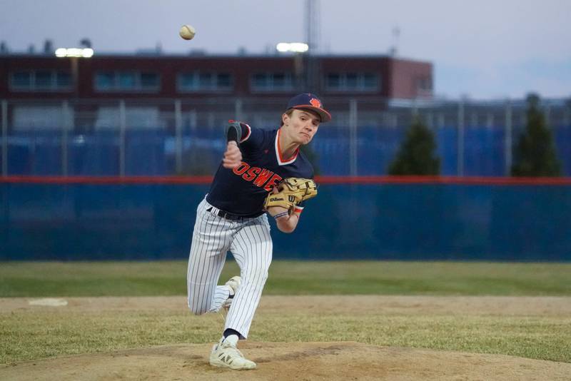 Oswego’s Andrew Ronek (1) delivers a pitch agains Benet during a baseball game at Oswego High School on Tuesday, March 25, 2025.