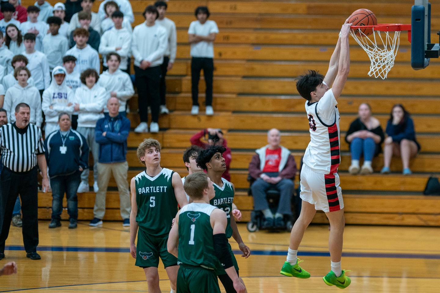 Benet’s Nikola Abusara (23) dunks the ball against Bartlett during the 4A Addison Trail Regional final at Addison Trail High School in Addison on Friday, Feb 24, 2023.