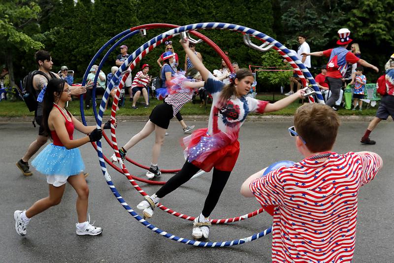 A girls rolls down the street during the Lake Bluff Fourth of July parade on Friday, July 4, 2025, in Lake Bluff.