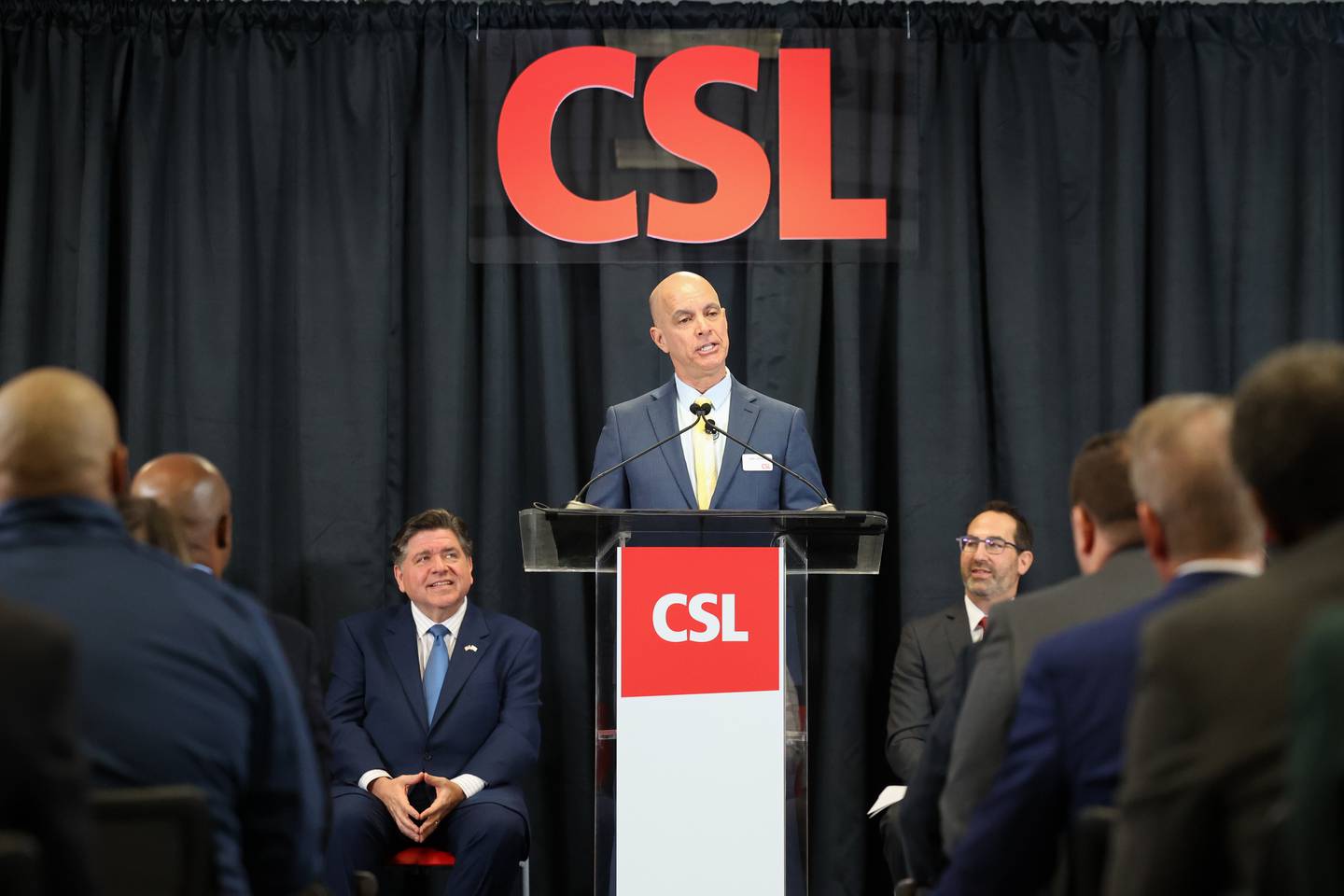 CSL Behring Kankakee Site Leader Jose Campos speaks at a press conference on Monday, March 9, 2026, at CSL Behring, which announced a $1.5 billion expansion to its Bourbonnais Township plant. Gov. JB Pritzker, left, was on hand at CSL Behring on Monday morning, along with many other state officials.