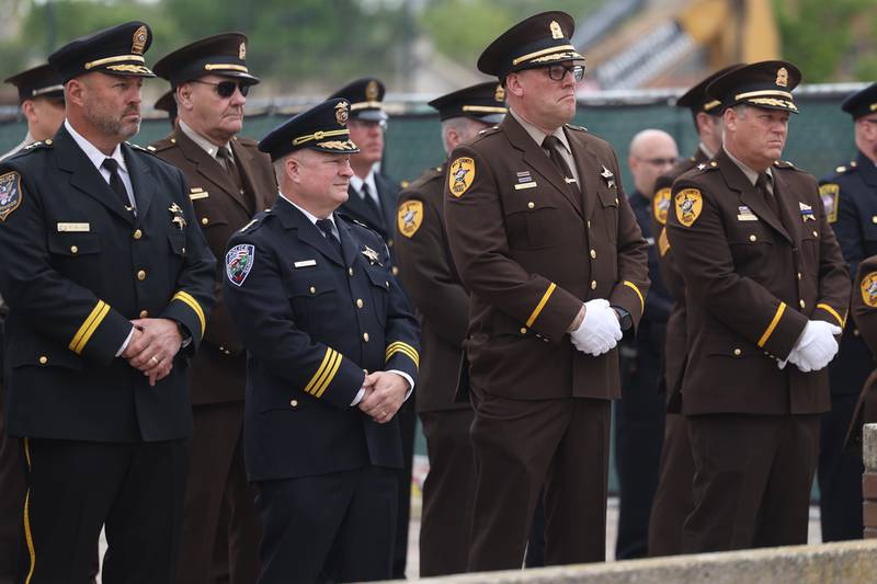 Officers from the Shorewood Police and the Mokena Police stand beside officers of the Will County Sheriff’s Police during the Will County Law Enforcement Memorial ceremony on Thursday, May 9, 2024 in downtown Joliet.