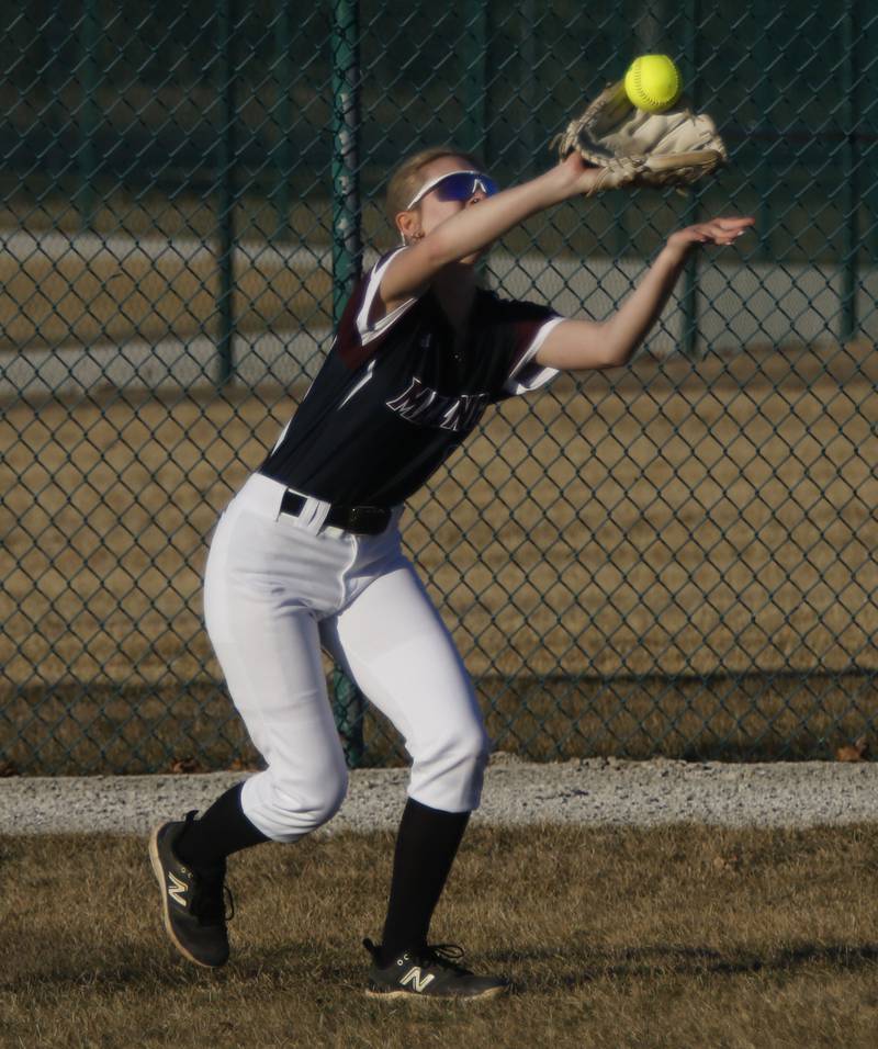 Marengo's Emma Anderson makes a catch in the outfield during a nonconference softball game against Jacobs on Monday, March 9, 2026, at Marengo High School.