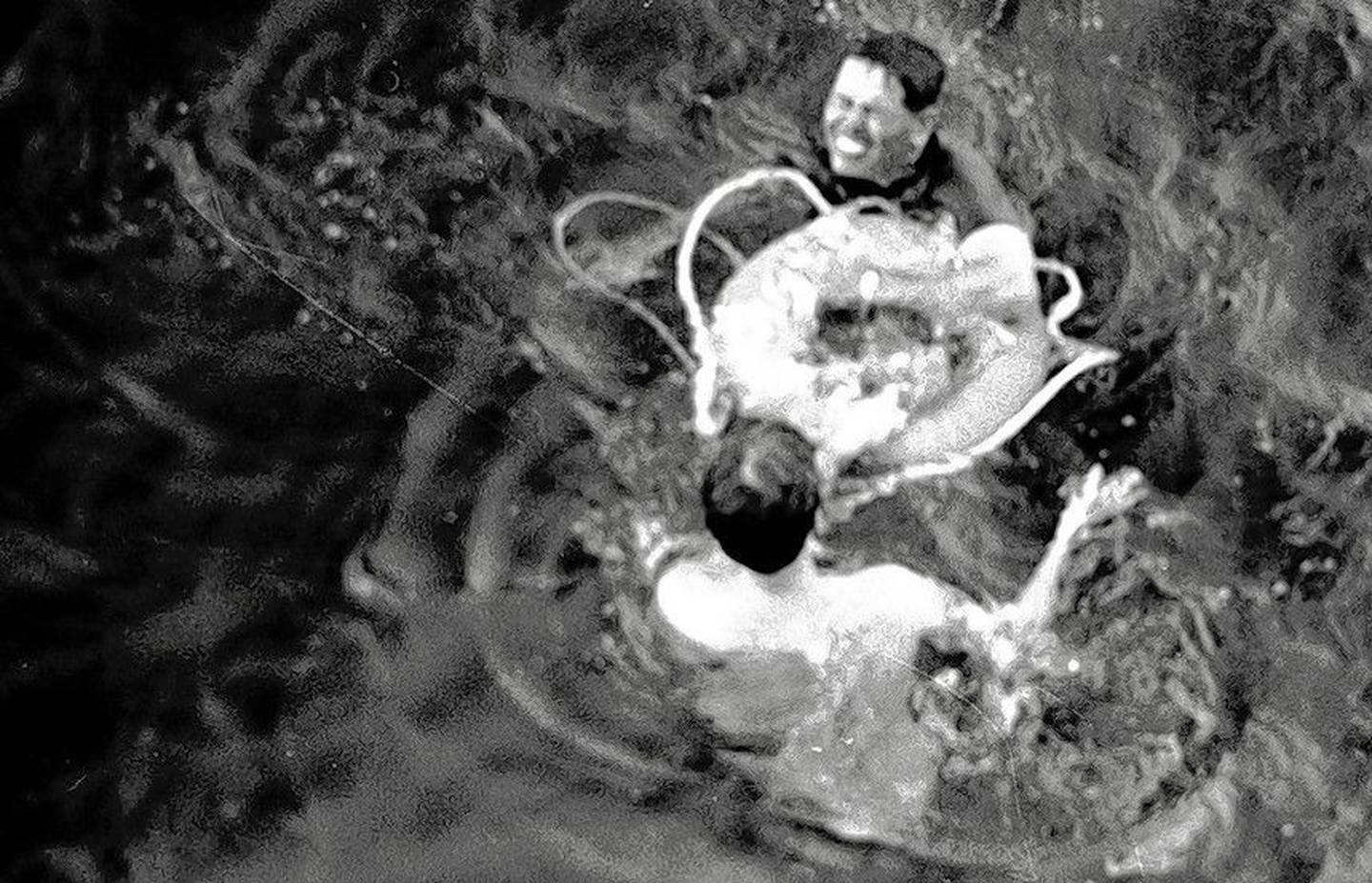 Sten Johnson of Woodstock, bottom, while a crew member of the U.S.S. Henry B. Wilson, rescues a wounded Marine from the waters off Cambodia's Kho Tang island during the Mayaguez incident in May 1975 -- the last battle of the Vietnam War.
