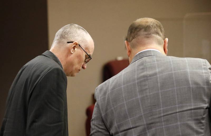 Robert J. Gould, 56, talks with his attorney Dominic Buttitta Jr. on Monday, Nov. 14, 2022, during his trial before Judge Michael Coppedge. Gould, who was on McHenry County’s most wanted list when arrested in 2017, is accused of repeatedly sexually abusing two children throughout their childhoods beginning in 2001.