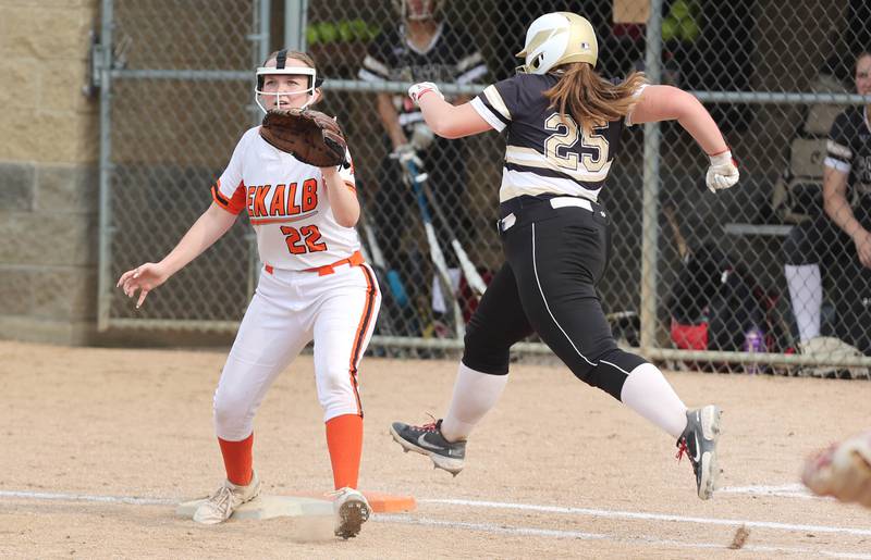 Sycamore's Rebecca Allen hustles to first as DeKalb's Bella Barker waits for the throw during their game against Sycamore Friday, May 20, 2022, at Sycamore High School.