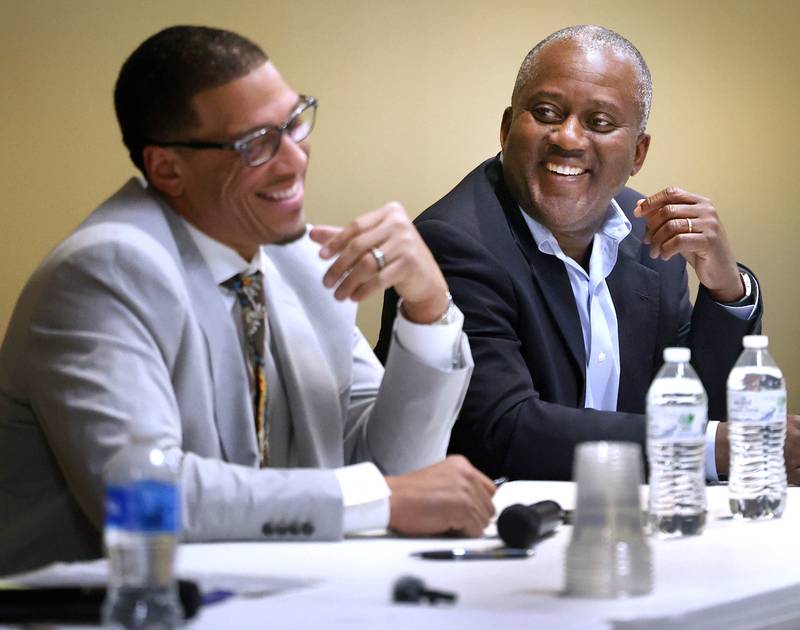 John Walker, (left) current DeKalb 7th Ward Alderman and candidate for mayor, talks to one of his opponents in the race for mayor Kouame Sanan Wednesday, Feb. 19, 2025, as they prepare for the start of the DeKalb Area Rental Association and DeKalb Area Builders Association Candidate Night at Faranda's Banquet Center in DeKalb. Others vying for the position of DeKalb mayor are current mayor Cohen Barnes and Linh Nguyen.