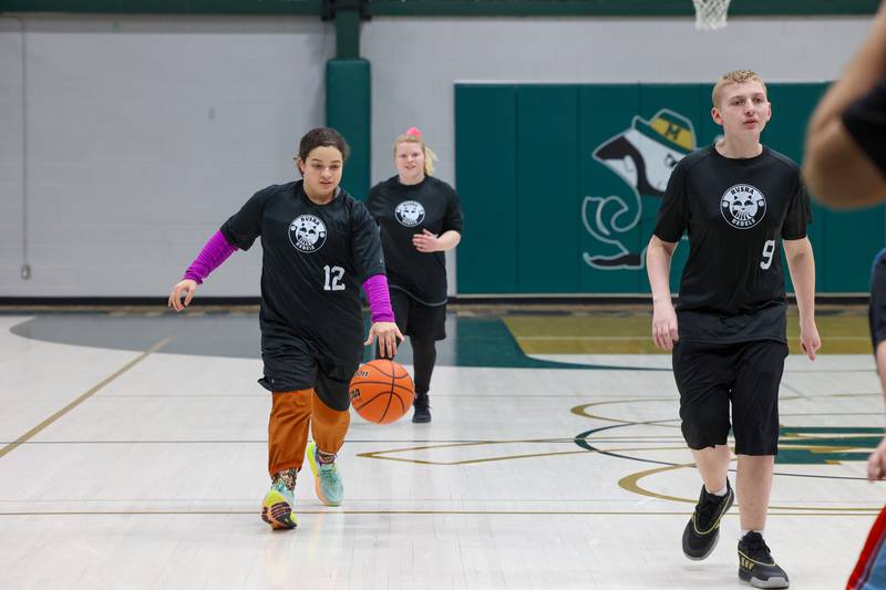 River Valley Special Rec player Reem Abdelmeguid brings the ball up alongside Ian Greene, right, in their game against Lincolnway Special Recreation Association at Bishop McNamara on Friday, Jan. 30, 2026.