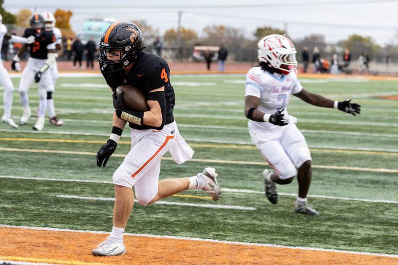 Lincoln-Way West's Ethan Swanson scores a touchdown during a 7A varsity football playoff game against Kenwood at Lincoln-Way West on Nov. 8, 2025.