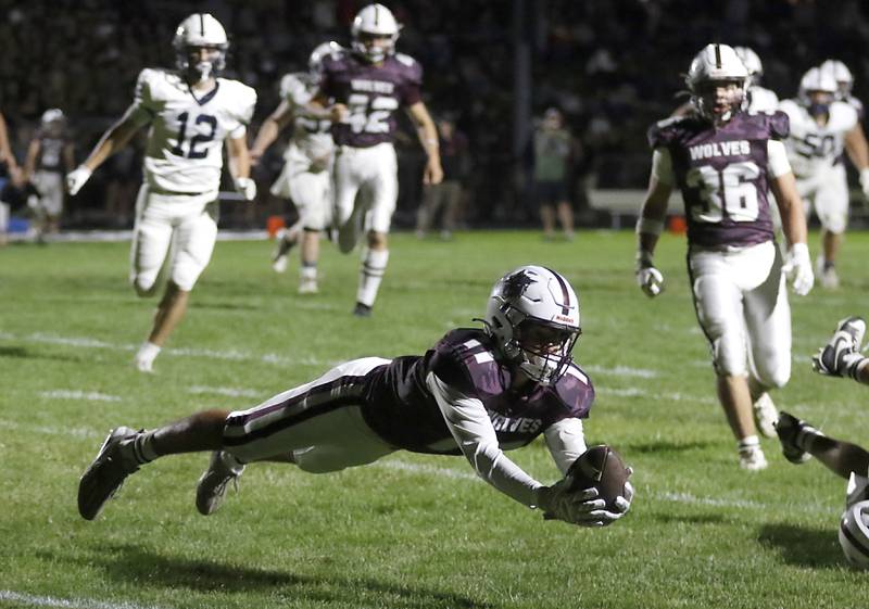 Prairie Ridge's Ben Gablenz priest to intercept the pass of Cary-Grove's Peyton Seaburg during a Fox Valley Conference football game on Friday, Sept. 27, 2024, at Prairie Ridge High School.