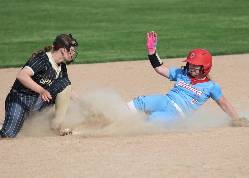 Ottawa's Reese Purcell slides in safely at second base as Sycamore's Brighton Snodgrass applies the tag Monday, May 12, 2025, during their game at Sycamore High School.