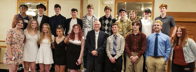 Members of the Whiteside Area Career Center's CEO class of 2022 pose with John Berge, center, winner of the Champion Award, during the Sauk Valley Area Chamber of Commerce annual meeting on Thursday at Days Inn in Rock Falls.