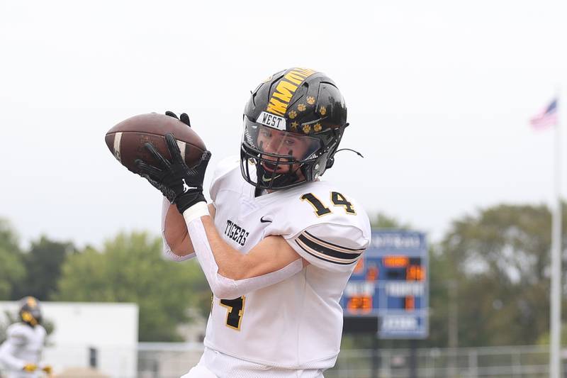 Joliet West’s Payton Turner pulls in a pass in the end zone against Joliet Central on Saturday, Sept. 28, 2024 in Joliet.