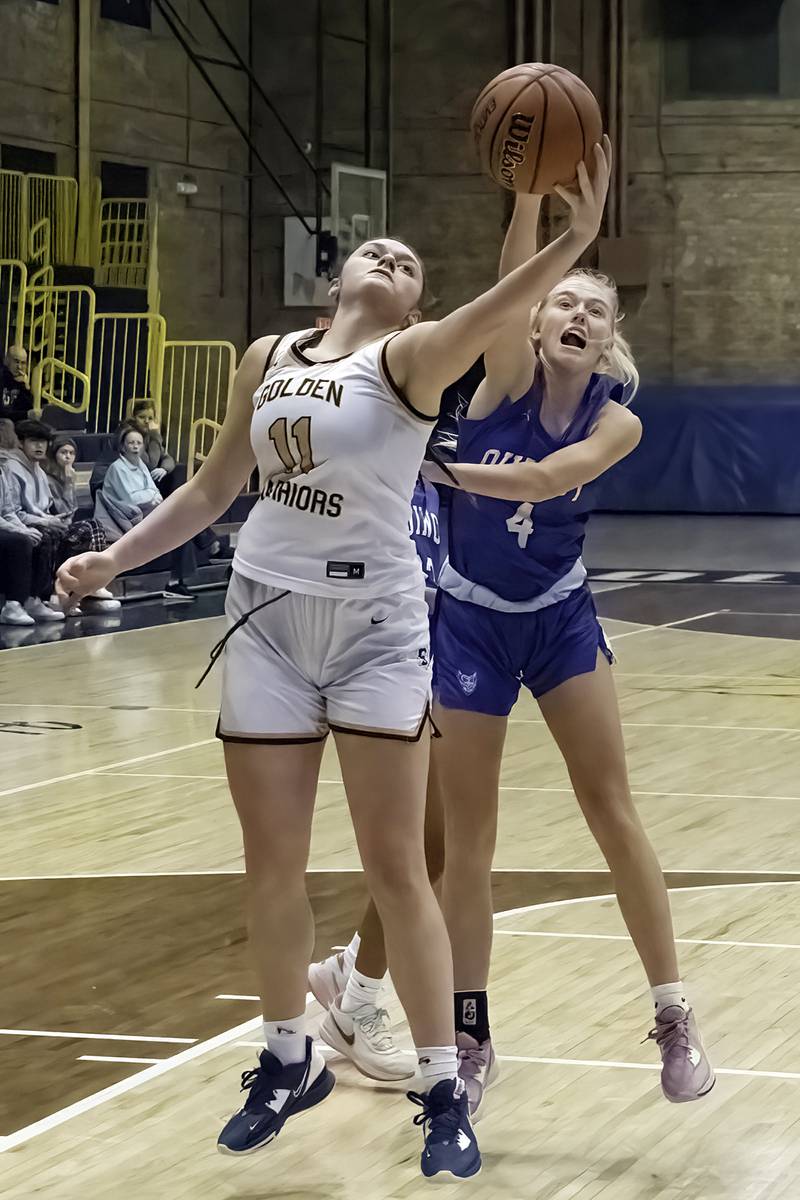 Sterling’s Kathryn Rowzee works below the basket against Quincy Saturday, Jan. 28, 2023.