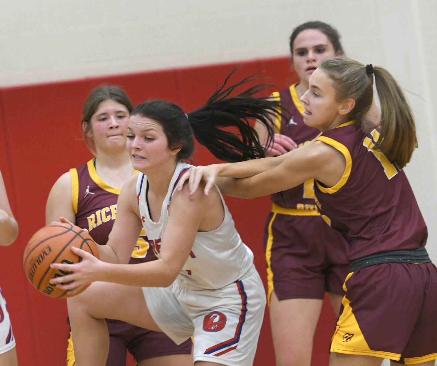 Oregon's Katelyn Bowers brings down a rebound between three Richmond Burton defenders at the Oregon Tip Off Tournament on Wednesday. Nov. 26