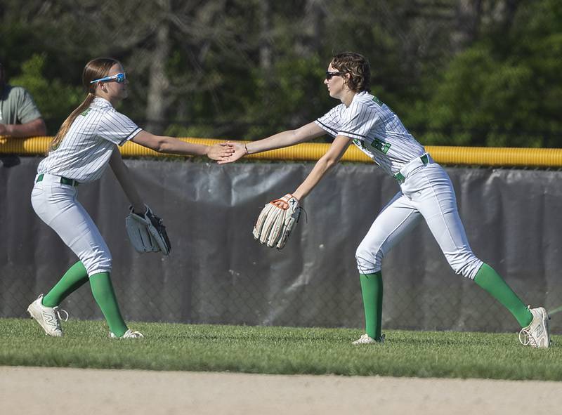 Rock Falls’ Hadley Osbourne (left) and Madisyn Eikenberry celebrate an out against Oregon Wednesday, April 22, 2026.