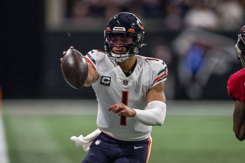Chicago Bears quarterback Justin Fields runs the ball during the first half against the Atlanta Falcons, Sunday, Nov. 20, 2022, in Atlanta.