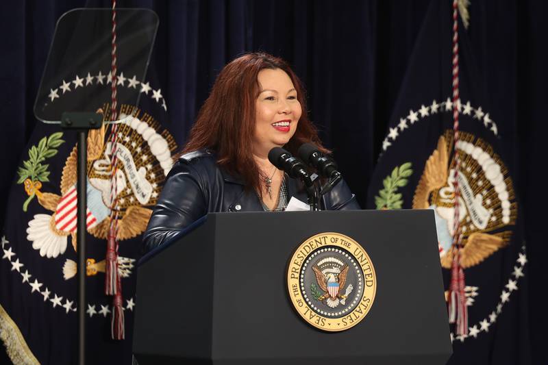 Senator Tammy Duckworth speaks before President Joe Biden takes the stage during his stop in Joliet at Jones Elementary School on Saturday.