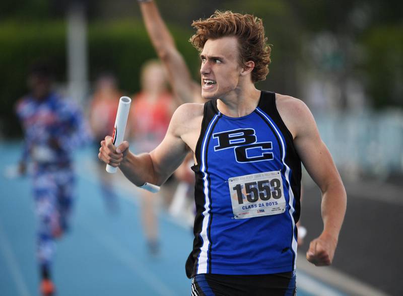 Burlington Central's Zac Schmidt looks to the crowd after crossing the finish line as the anchor leg of the 4x400-meter relay team that took second place in their heat on June 18, 2021 at the Class 2A Boys Track and Field State Meet in Charleston.