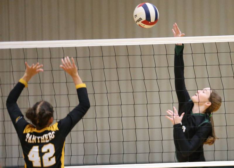 St. Bede's Lili McClain spikes the ball past Putnam County's Eme Bouxsein on Tuesday, Sept. 24, 2024 at St. Bede Academy.