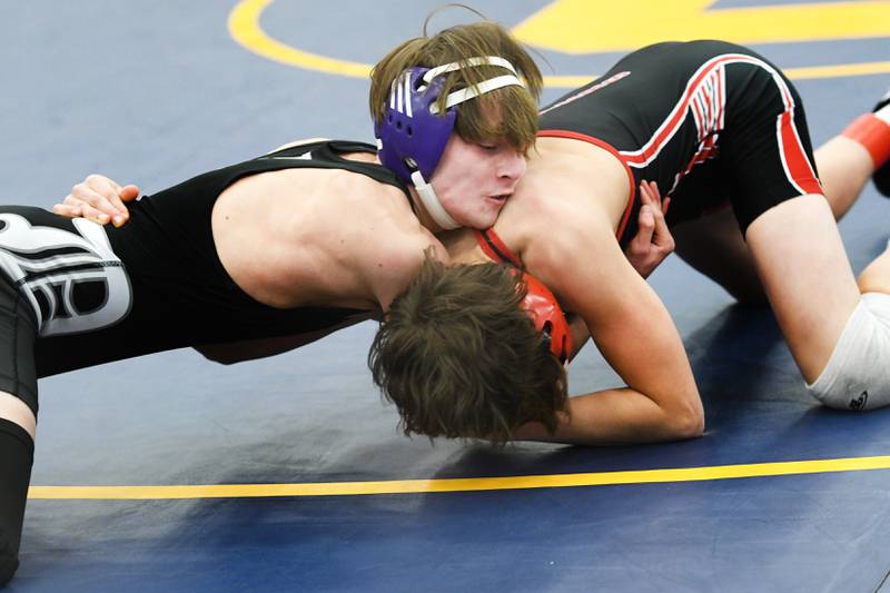 Dixon's Ayden Rowley (left) wrestles Amboy's Landon Blanton for the 113-pound championship at the 1A Polo Wrestling Regional held at Eastland High School in Lanark on Saturday, Feb. 4.