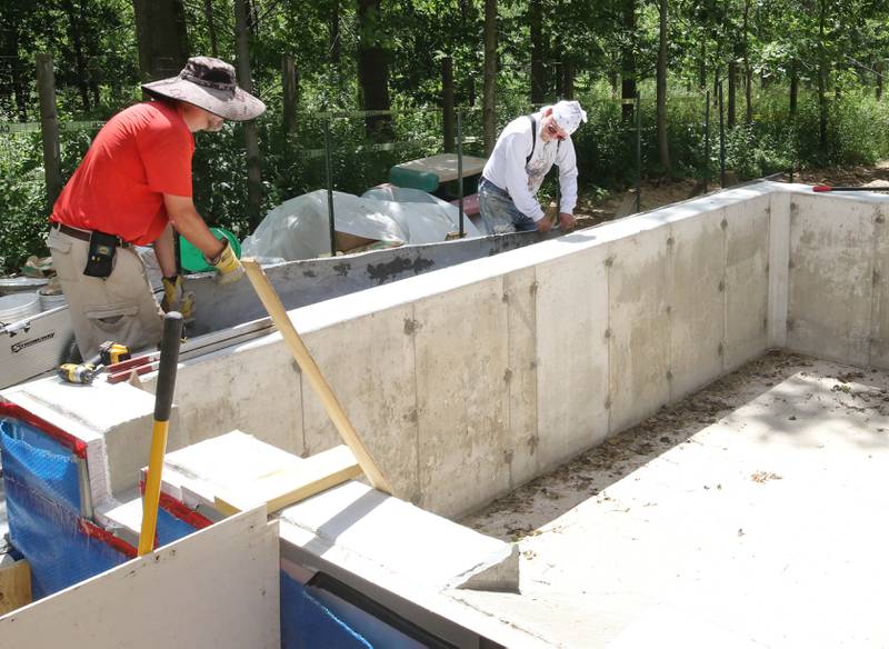 Volunteers build a pond Tuesday, June 18, 2024, at Oaken Acres Wildlife Center in Sycamore. Oaken Acres is celebrating its 40th anniversary this year.